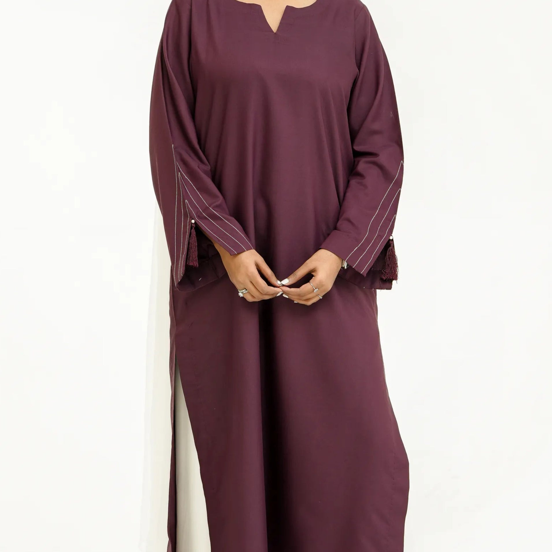 Minimal eastern wear with tassel sleeve detailing
