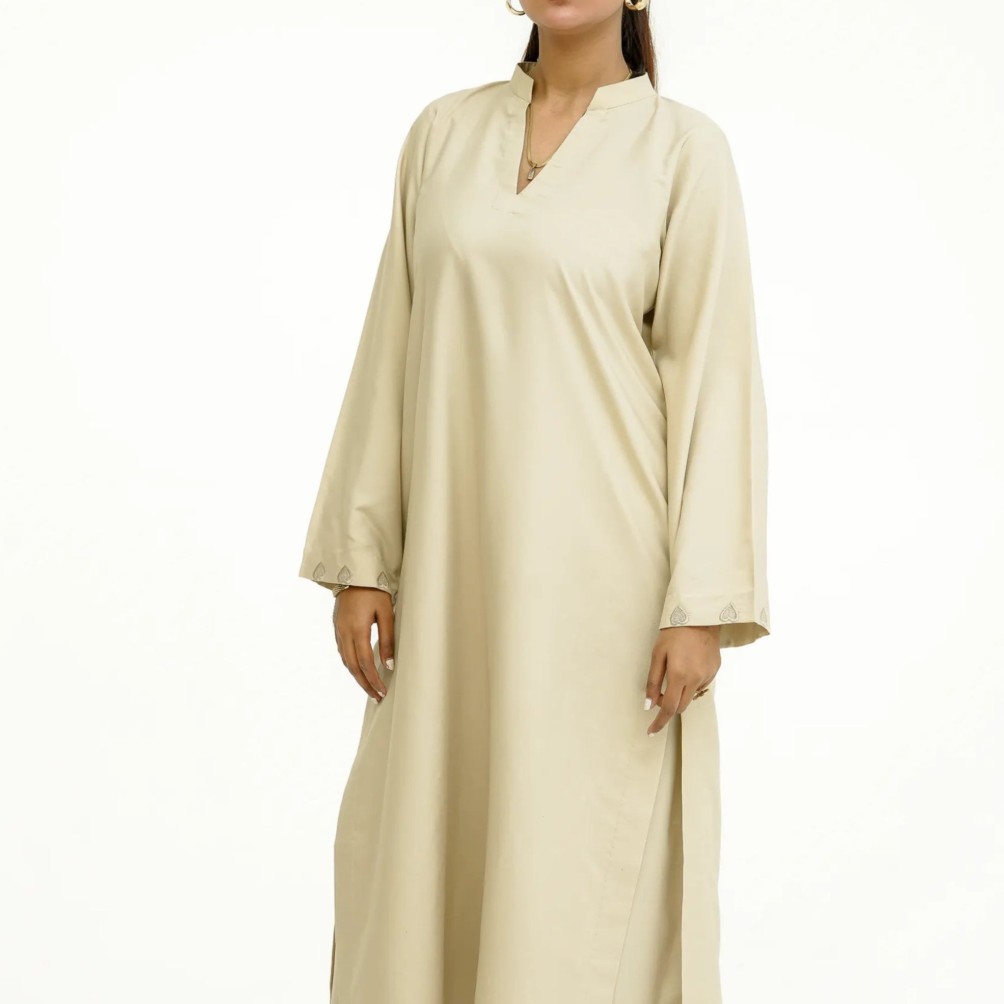 Woman wearing ivory “Afsaana | افسانہ” eastern outfit