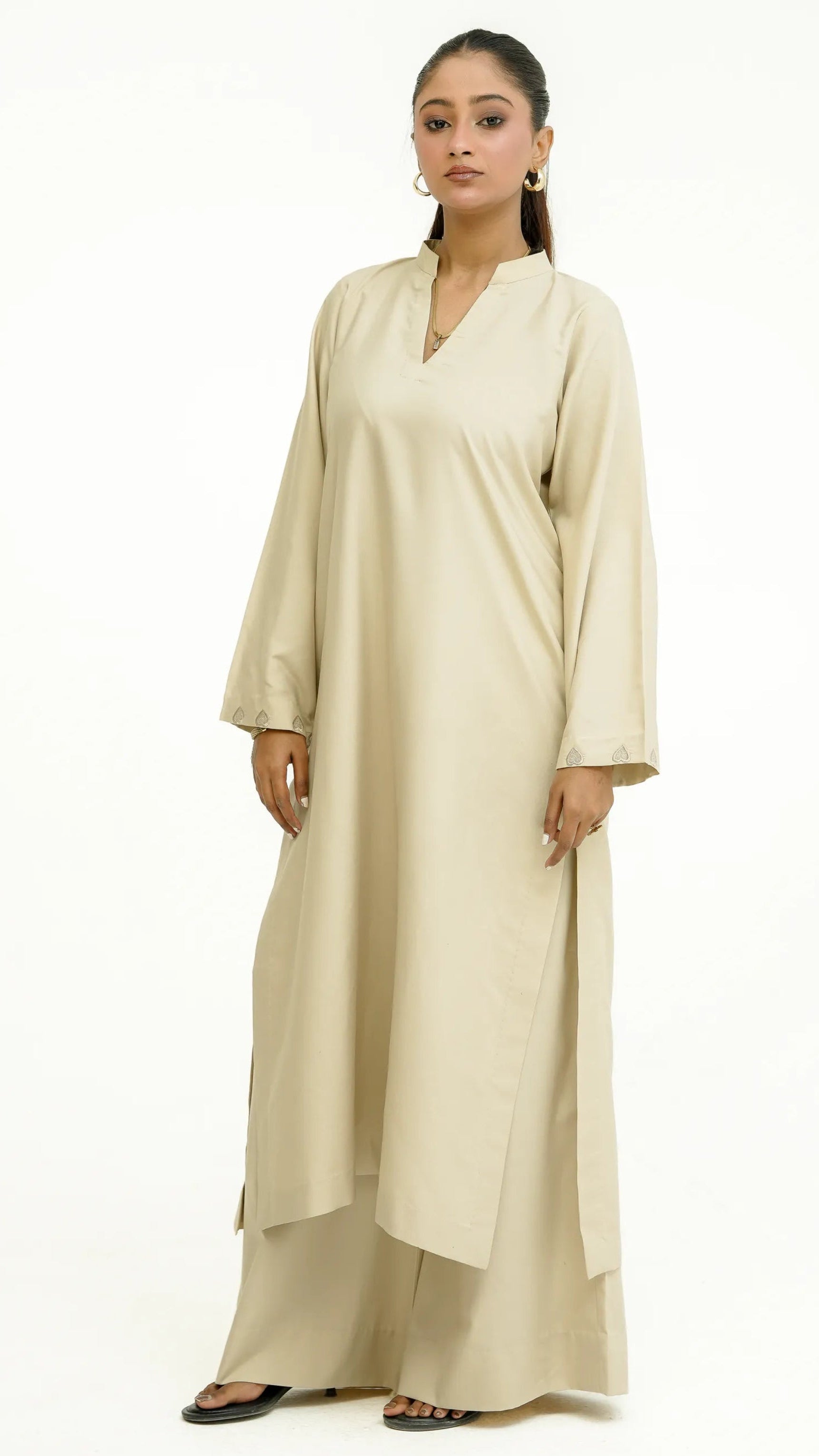 Woman wearing ivory “Afsaana | افسانہ” eastern outfit